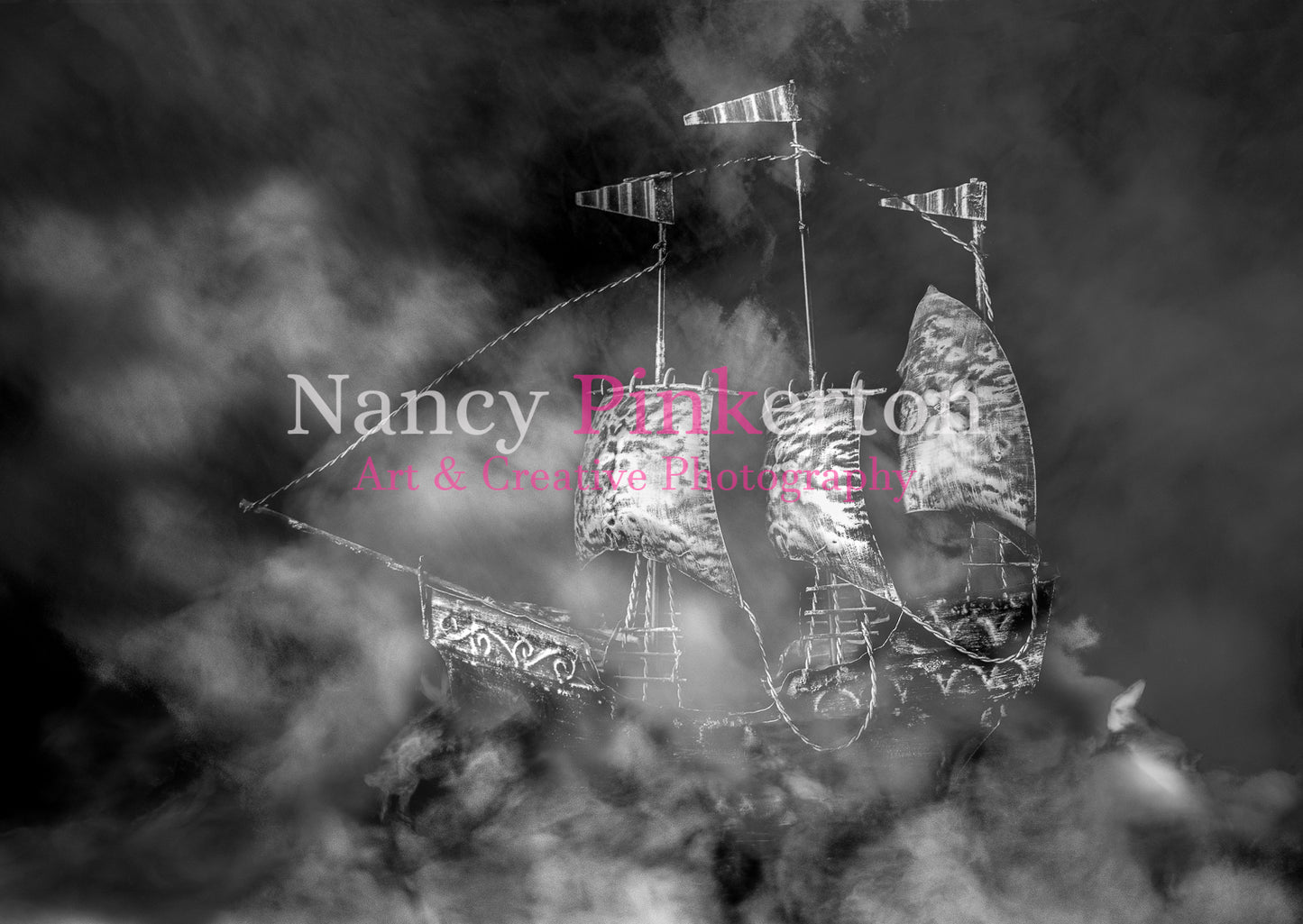 A monochrome photograph depicting ethereal smoke-like figures in the shape of hares and a ship, representing King James belief in witchcraft and supernatural.