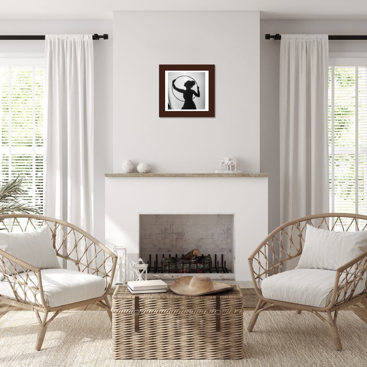 Living room with wicker chairs, a coffee table, and a fireplace featuring artwork on the wall.